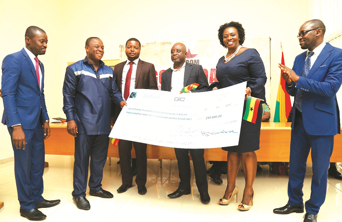  Mrs Aba Lokko (2nd right) presenting the cheque to the Planning Committee